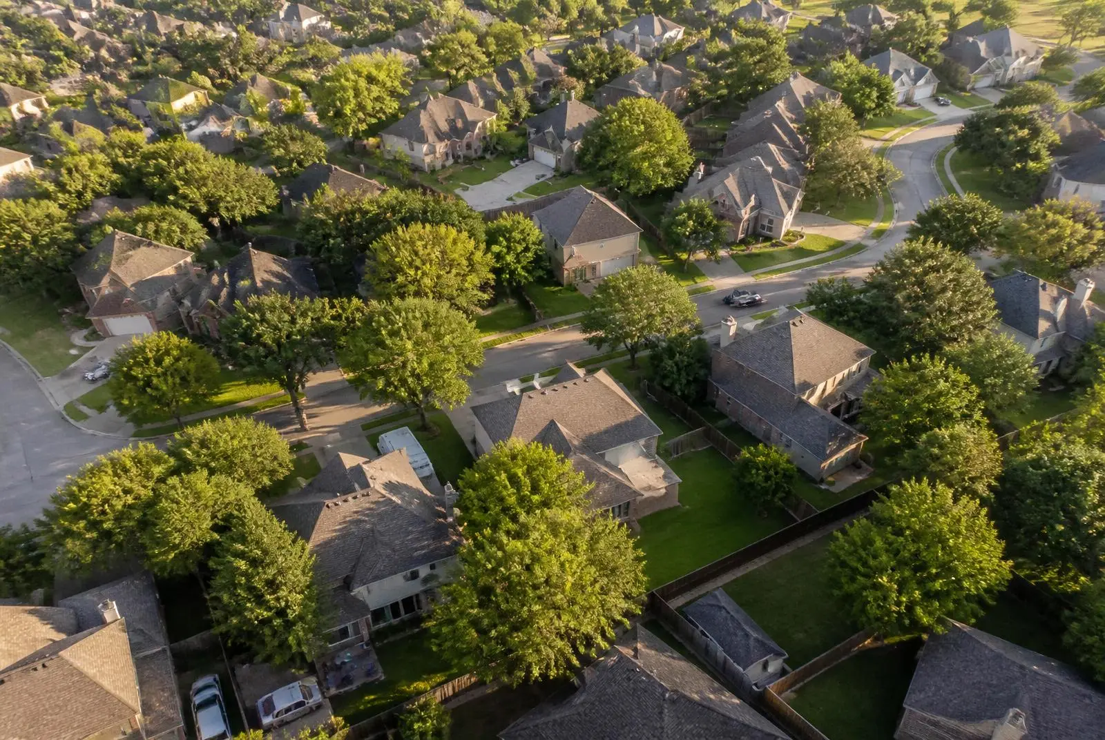 Aerial view of an American suburban neighborhood served by local roofing companies